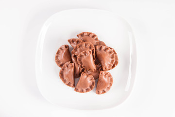 Traditional polish dumplings called pierogi - chocolate flavour with cheese