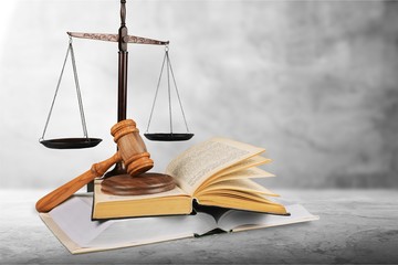Justice Scales and books and wooden gavel on table. Justice
