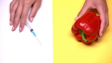 Genetically modified products, pepper and syringe macro shot, vegetable breeding