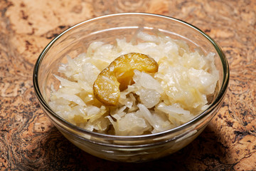 Traditional organic raw and fermented sauerkraut with pickled Persian cucumbers.