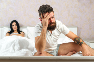 Unhappy married couple and sexual problems concept. Frustrated man and woman not talking feeling...