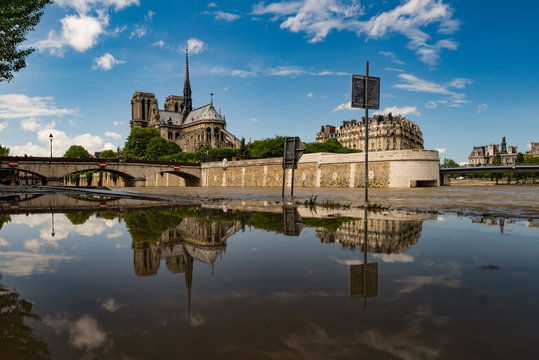 View of Notre Dame cathedral against cloudy sky