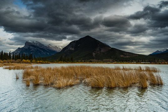 Scenic view of Two Jake Lake against stormy clouds