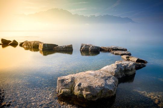 Scenic view of stepping stones in lake
