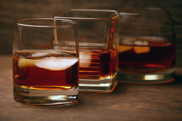 ice whiskey glass wooden background 