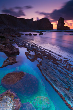 Scenic view of Playa de la Arnia beach during sunset