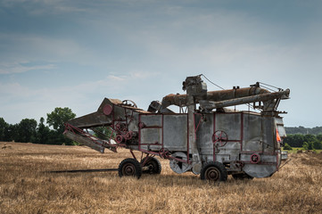Vintage Steam Thresher in Cut Field