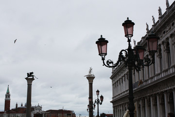 Fototapeta na wymiar San Marco square in Venice Italy in rainy day. Column with lion. Palace