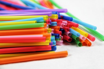 Colorful plastic drinking straws close up