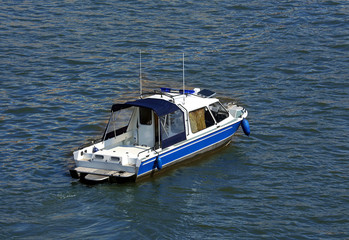 Small boat on the water, top view