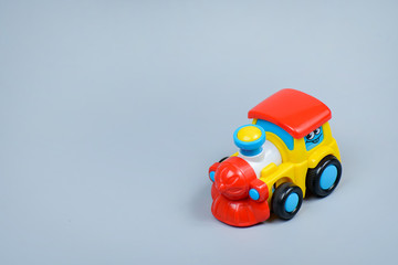  Toy locomotive on a gray background