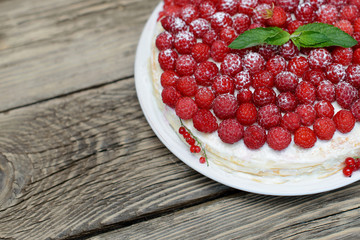 Raspberry cake on wooden table