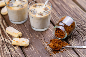 Iced iced coffee on a wooden table. Summer drinks.