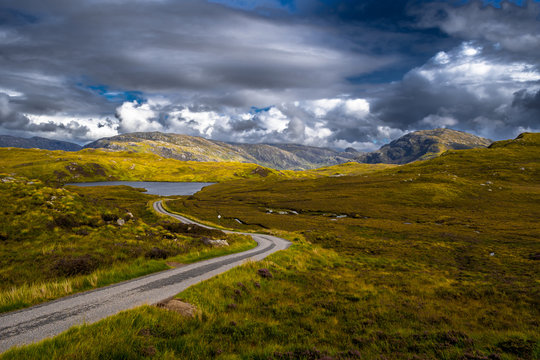 Abandoned Single Track Road To Unapool And Kylesku Beneath Loch Unapool In Scotland
