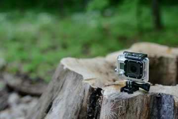 Obraz premium action camera go pro in the forest