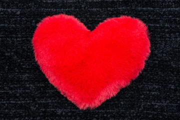 Red fluffy heart isolated on black background