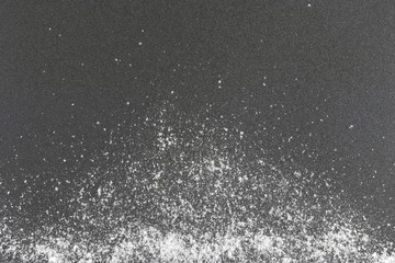 salt scattered on a gray background / background photo salt scattered on a gray background