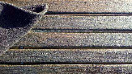 wooden bench with coat