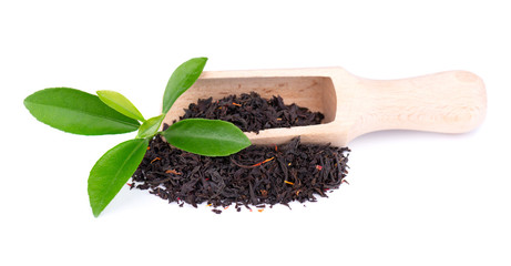 Black Ceylon tea with flower petals and bergamot, isolated on white background.