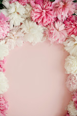 Happy mothers day floral greeting card mockup. Stylish peonies flat lay. Pink and white peonies frame on pastel pink paper with space for text. International Womens Day. Valentines day.