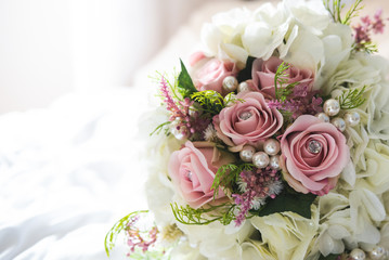 Bridal flowers bouquet with roses and ribbon