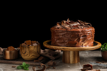 Composition with tasty homemade chocolate cake on table