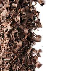 Curls of tasty chocolate on white background, top view