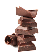Yummy chocolate curls and pieces on white background