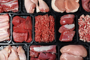 Containers with different raw meat, top view