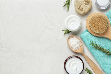 Flat lay composition with body care products and space for text on light background