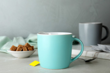 Obraz na płótnie Canvas Cup of delicious hot tea on table