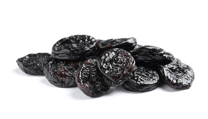 Heap of tasty prunes on white background. Dried fruit as healthy snack