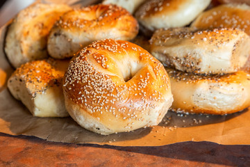 Assortment of authentic fresh baked New York style bagels with seeds - obrazy, fototapety, plakaty