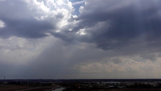 4 K Clouds With Sunrays Over Landscape Timelapse 002