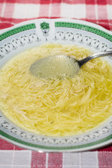 Closeup image of homemade chicken soup with noodles