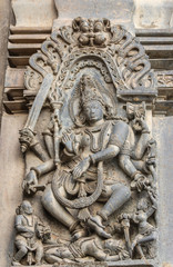 Belur, Karnataka, India - November 2, 2013: Chennakeshava Temple building. Stone statue of Gajasurasamhara, Lord Shiva slaying the demon under his feet. 