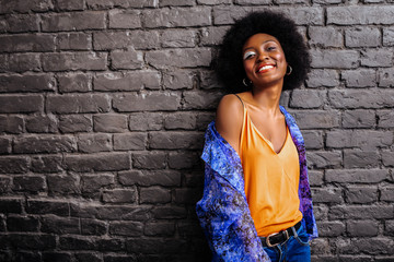 Adorable african american model in a trendy shirt posing for the photo