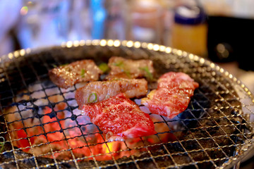 Japanese grilled meat over charcoal on stove
