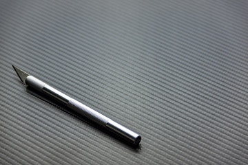 Surgical stainless steel metal scalpel isolated on Carbon 3