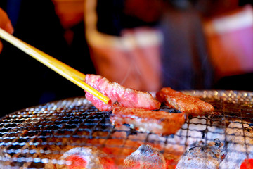 Japanese grilled meat over charcoal on stove
