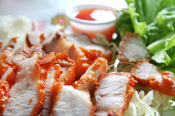 Thai roasted pork (Char Siew) served with thai chili sauce and lettuce