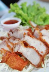 Thai roasted pork (Char Siew) served with thai chili sauce and lettuce