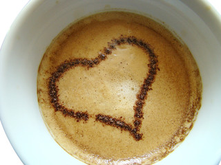 a cup of coffee with a heart
