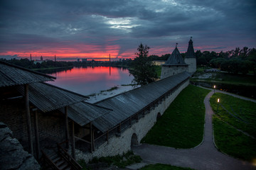 Crimson sunset above Pskov fortress watch towers
