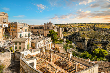 Obraz na płótnie Canvas The Convent of Saint Agostino overlooks the canyon and the ancient sassi caves in the city of Matera, Italy.