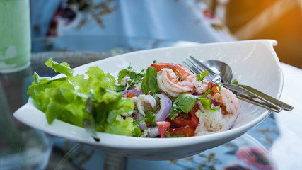 Vermicelli salad with shrimp in a white plate