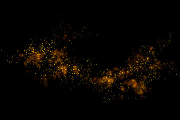 Fototapeta na wymiar Gold glitter particles lights and bokeh on a black background. Christmas abstract sparkle texture.