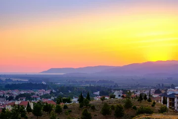 Foto op Canvas Selcuk, Turkey. Panorama of the view of the city and the mountains at sunset. © Tereza