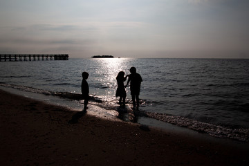 Young Kids on the beach at sunset