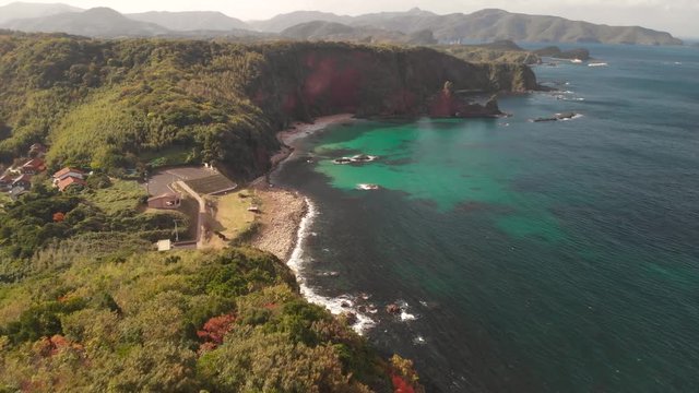 High aerial view of Oki Island lighthouse with beautiful bay in distance, Shimane Prefecture, Japan